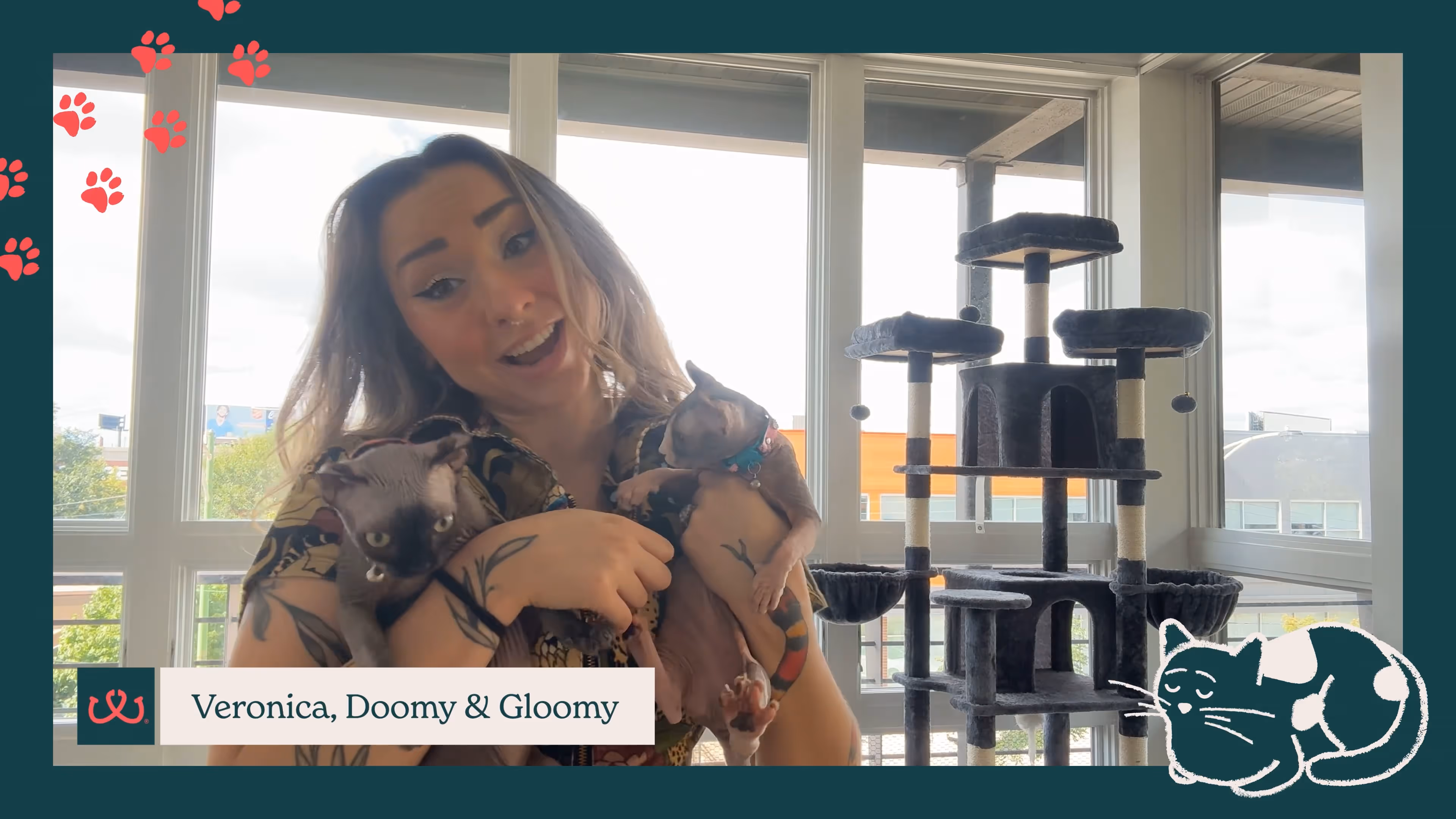 Pet parent with cat and dog at Sploot Veterinary Care
